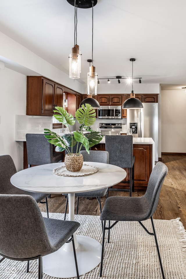 dining room with light hardwood / wood-style floors