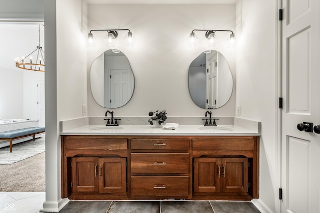 bathroom featuring vanity and an inviting chandelier