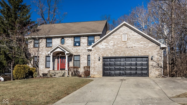 view of front of home with a garage and a front yard