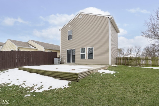 back of property with a patio area, a lawn, and central air condition unit