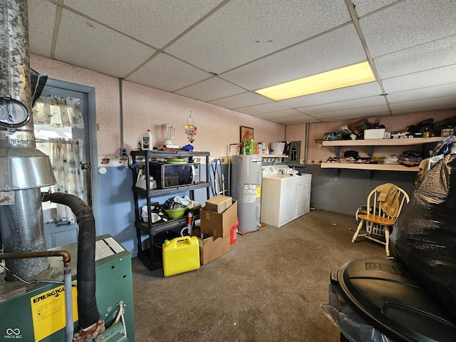 basement with water heater, carpet floors, a drop ceiling, and washer and clothes dryer