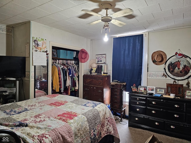 bedroom featuring ceiling fan and a closet