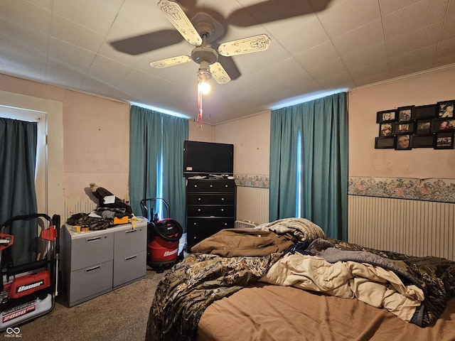 bedroom with ceiling fan and carpet flooring