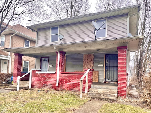 view of front of property featuring covered porch