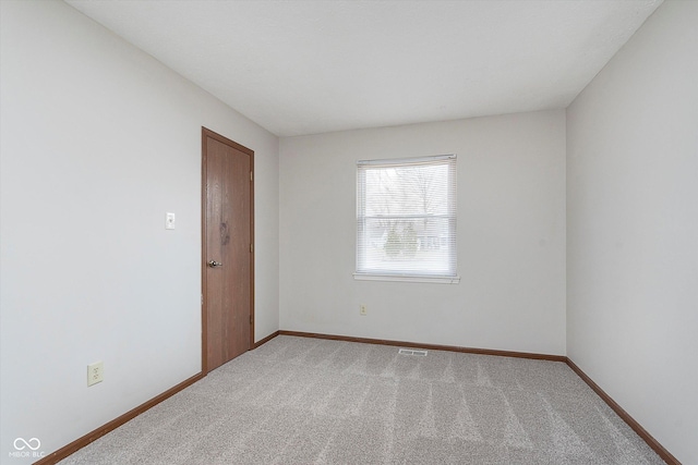 spare room featuring carpet floors