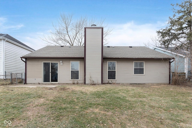 back of property featuring a lawn