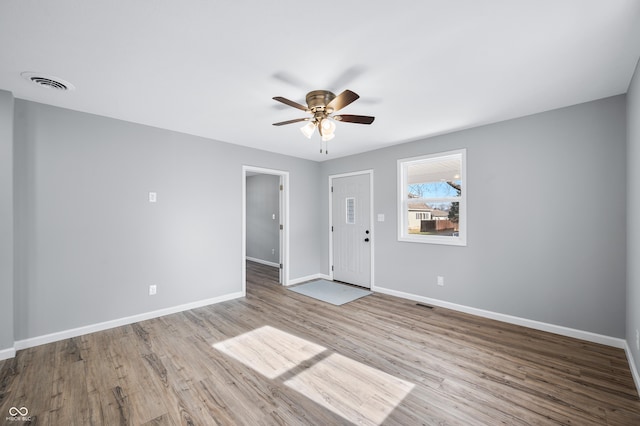 unfurnished room featuring ceiling fan and light hardwood / wood-style flooring