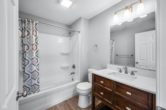 full bathroom featuring vanity, hardwood / wood-style floors, toilet, and shower / bath combo with shower curtain