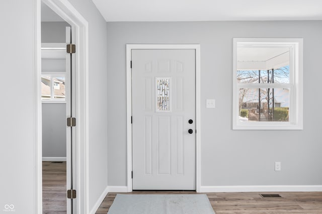 entrance foyer with hardwood / wood-style floors