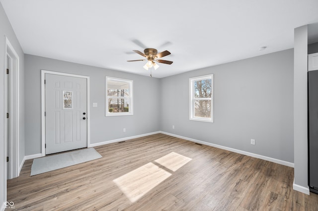 entryway with ceiling fan and light wood-type flooring