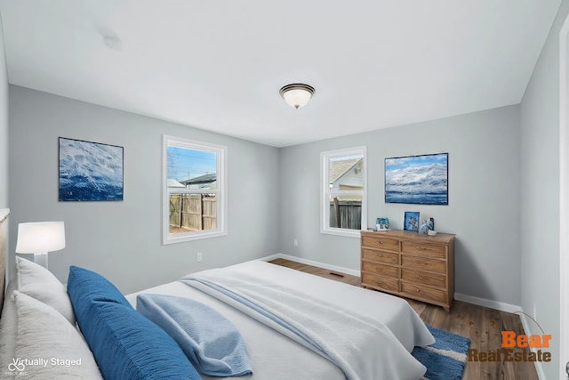 bedroom with hardwood / wood-style floors