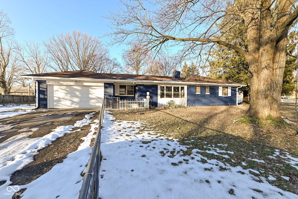 single story home with a garage