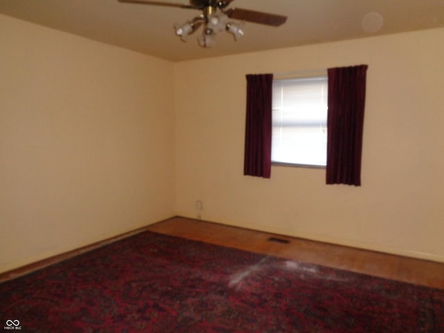 unfurnished room with ceiling fan