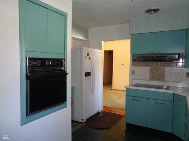 kitchen featuring tasteful backsplash, green cabinetry, and black appliances