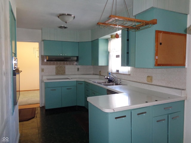 kitchen with sink, decorative backsplash, oven, and black electric stovetop