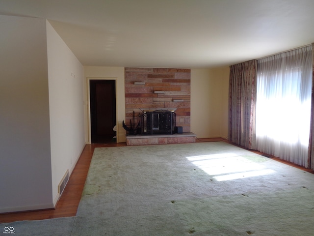 unfurnished living room featuring a fireplace