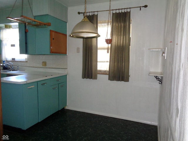 kitchen featuring sink and backsplash