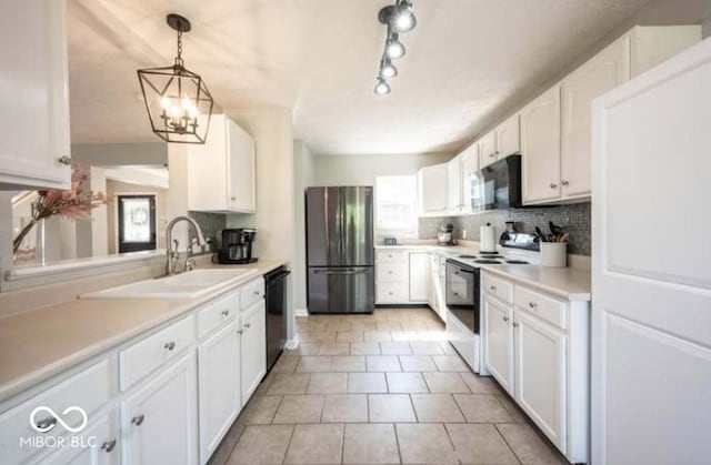 kitchen featuring white cabinetry, backsplash, decorative light fixtures, and black appliances