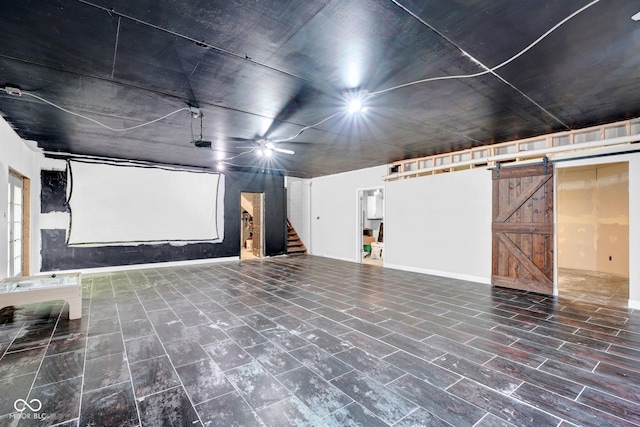interior space featuring stairway and a barn door