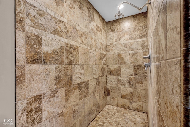 bathroom with tiled shower