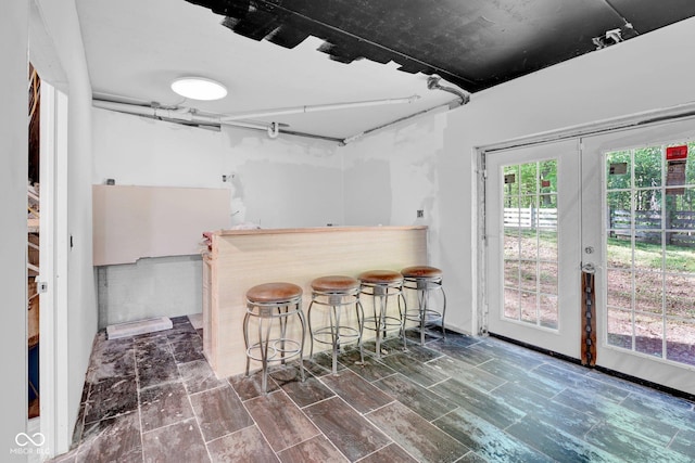 bar featuring a dry bar and french doors