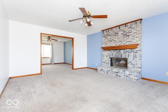 unfurnished living room with a brick fireplace, light carpet, ceiling fan, and a textured ceiling