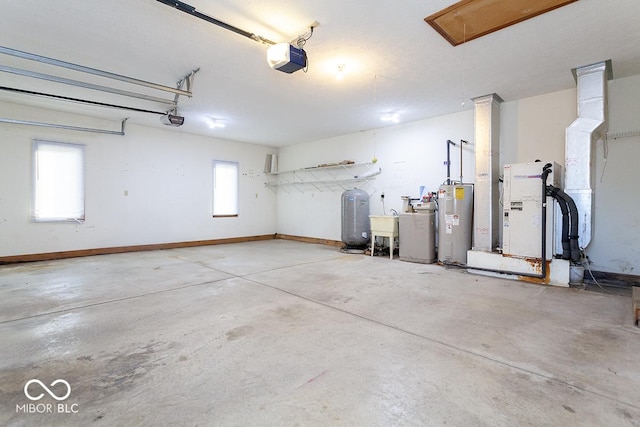 garage featuring water heater, sink, and a garage door opener