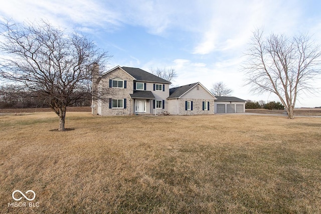 view of front of property with a front lawn and a garage