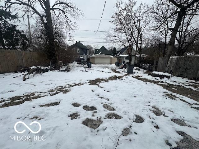 view of yard covered in snow