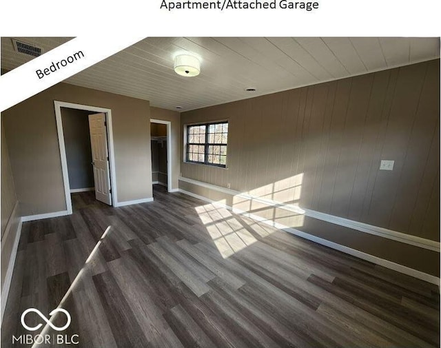 spare room featuring dark hardwood / wood-style floors