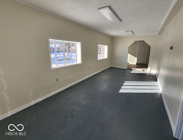 empty room featuring a textured ceiling