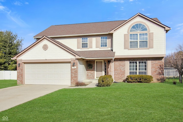 view of property featuring a garage and a front lawn