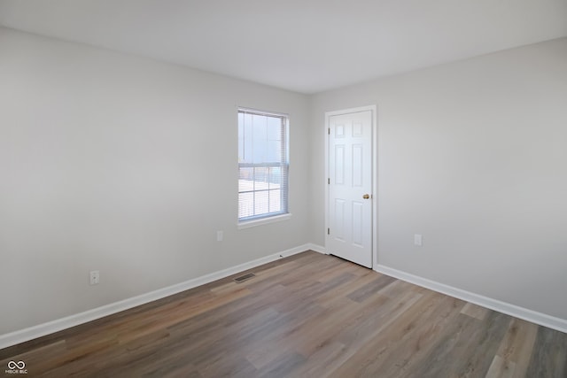 empty room featuring hardwood / wood-style floors