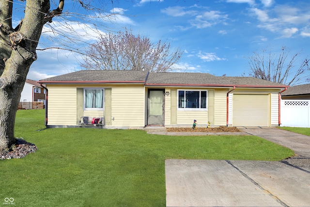 ranch-style home featuring a garage and a front yard