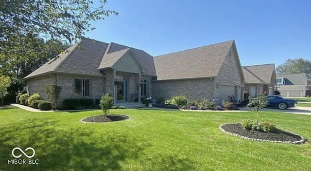 view of front of home with a garage and a front yard