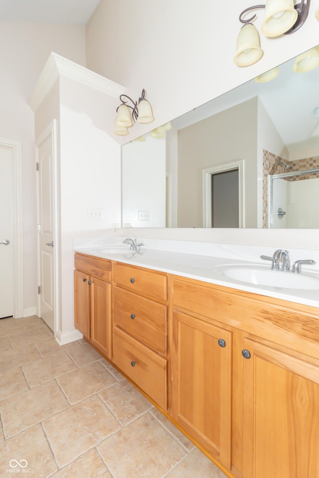 bathroom with an enclosed shower, vanity, and lofted ceiling