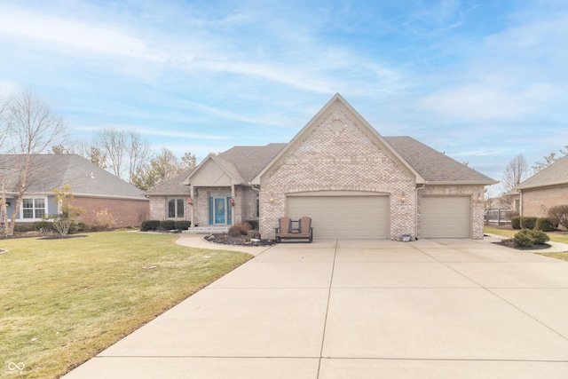 view of front of house featuring a garage and a front yard