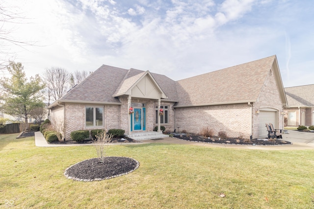 view of front of property featuring a garage and a front lawn