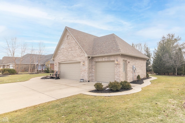 view of home's exterior with a garage and a yard