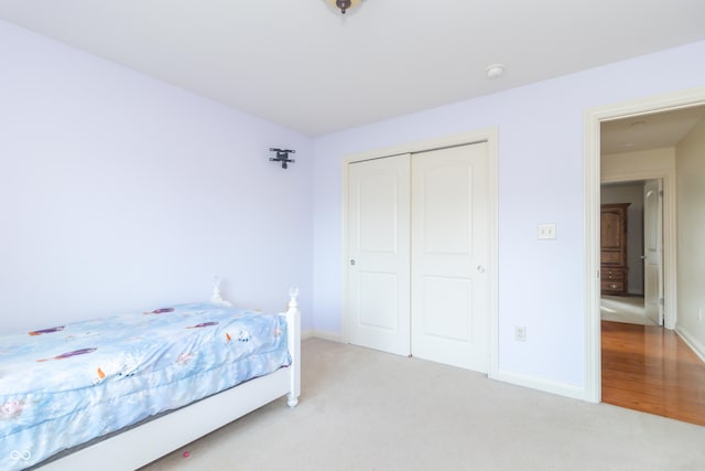 bedroom with a closet and carpet flooring