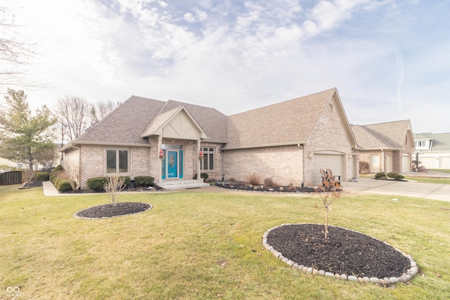 view of front of property with a garage and a front lawn