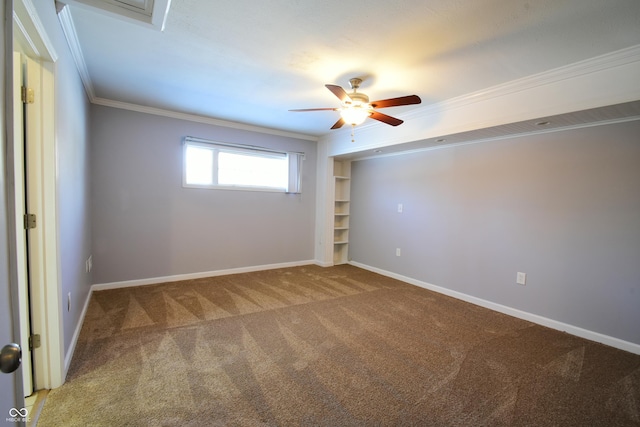 unfurnished room with ceiling fan, ornamental molding, and carpet