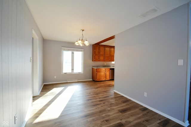 interior space with an inviting chandelier, hardwood / wood-style flooring, and a baseboard radiator