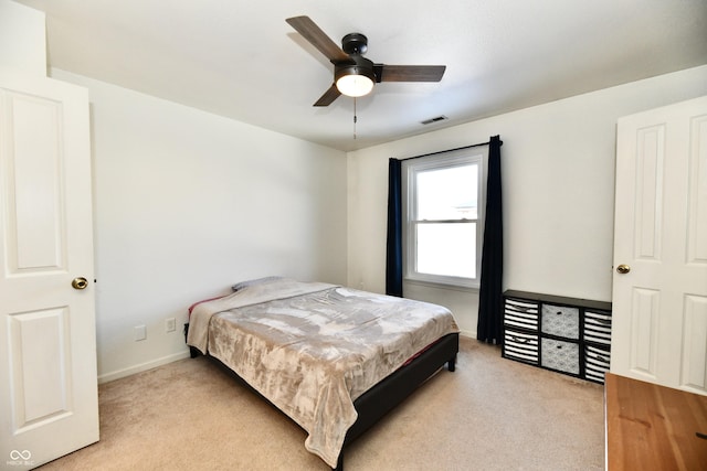 carpeted bedroom with ceiling fan