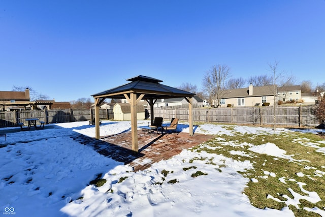 yard covered in snow featuring a gazebo