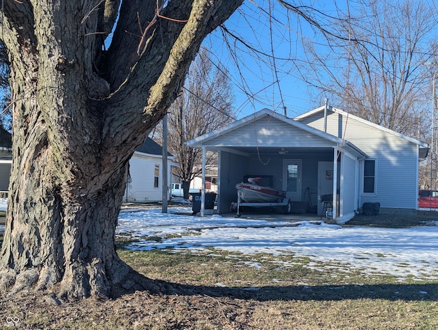 view of front of house featuring a carport