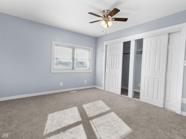 unfurnished bedroom featuring a closet, ceiling fan, and carpet flooring