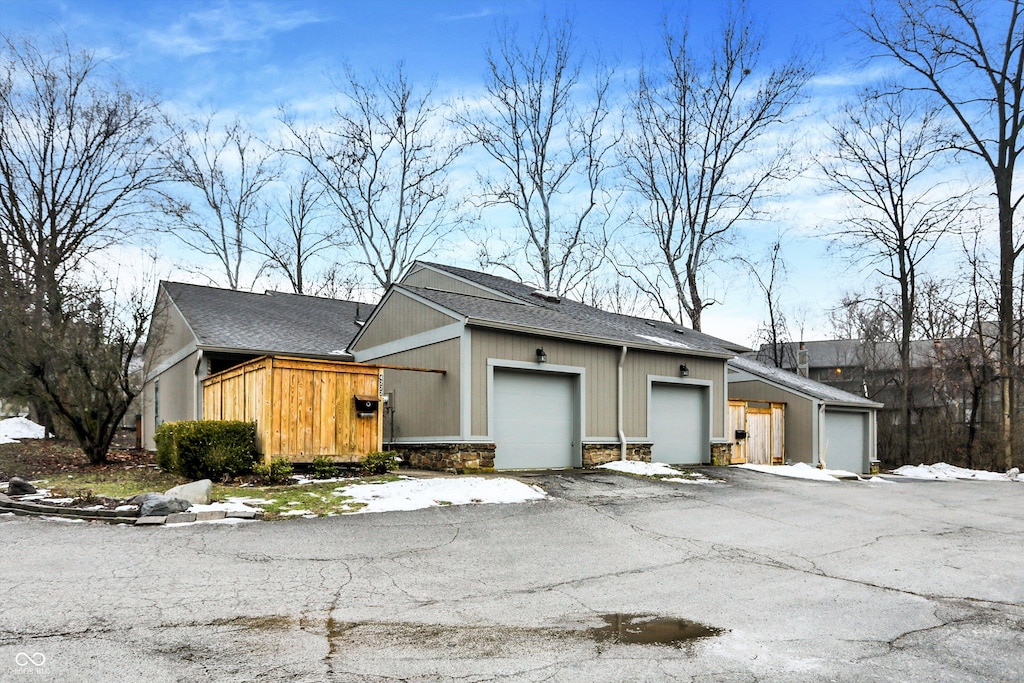 view of side of property featuring a garage