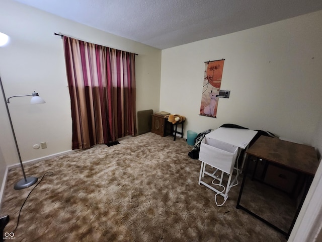 bedroom featuring carpet floors and a textured ceiling