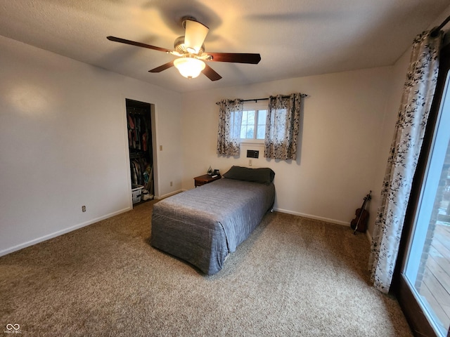 bedroom with ceiling fan and carpet